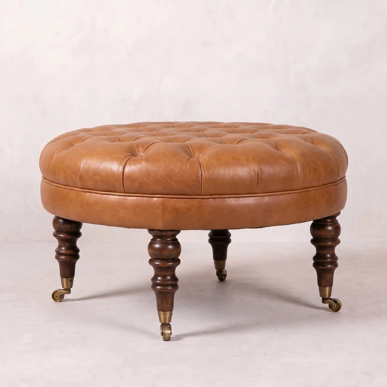Brown Buffalo Leather Round Ottoman with Castor Legs